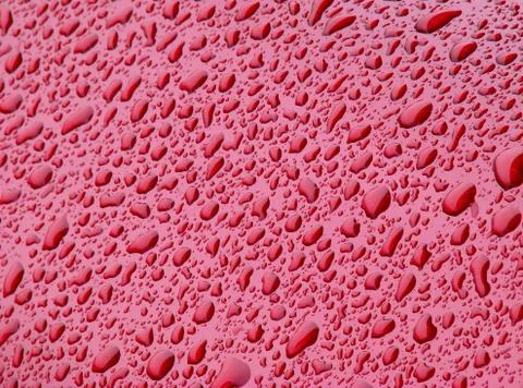 Watr condensate on red surface Stock Photos