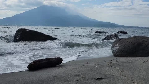 Wave action splashes against rocky shore 스톡 동영상 337697298