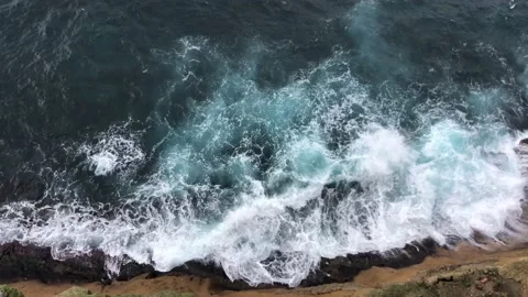 Wave after wave splashes about big stones on shore. Stock Footage 230903750