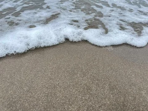 Wave and beach Stock Photos