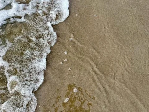Wave and beach Stock Photos