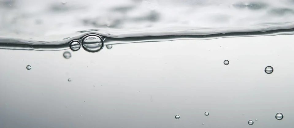 Wave and bubbles Stock Photos