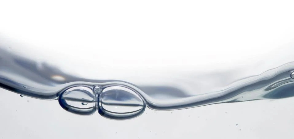 Wave and bubbles Stock Photos
