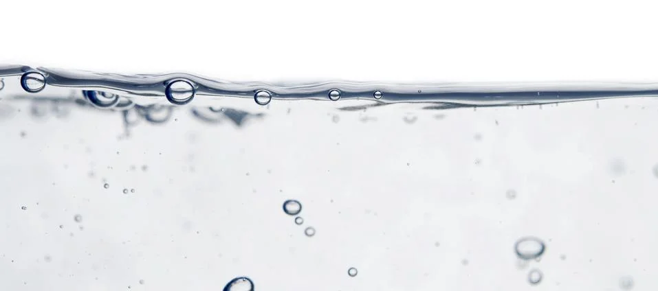 Wave and bubbles Stock Photos