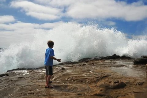 Wave and kid Stock Photos