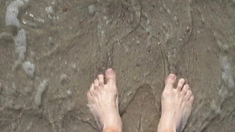 Wave and legs Stock Footage 94829988