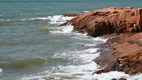Wave and rock at slow motion Stock Footage 334609010