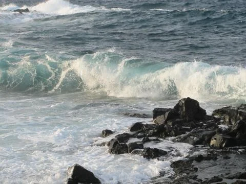 Wave and rocks Stock Photos