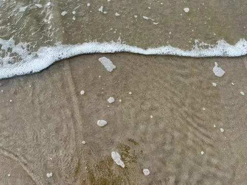 Wave and the sand Stock Photos