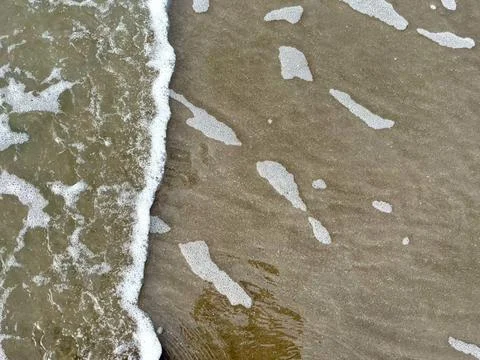 Wave and the sand Stock Photos