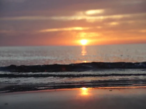 Wave and sunset Stock Footage 124825901