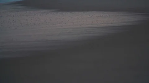Wave arriving at the beach in slow motion 動画素材 128142418