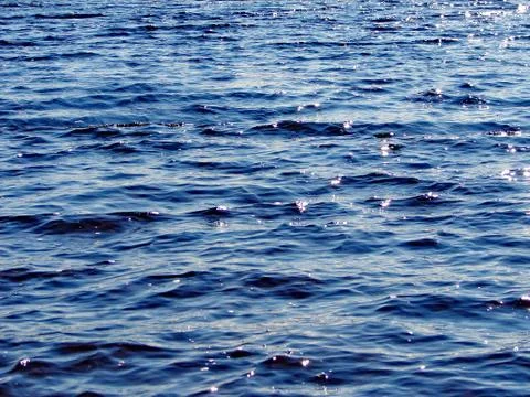 Wave background on a lake with small waves Stock Photos