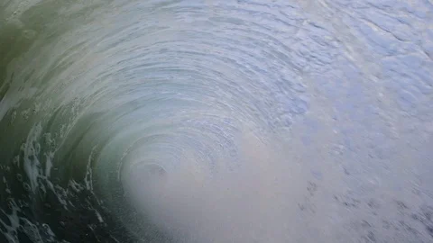 Wave backwash splash explosion under dark moody skies Vídeos de archivo 107641029