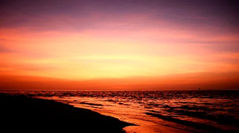 Wave at beach and red sky Stock Footage 39015689