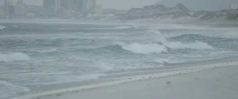 Wave on a beach pan left to right - UHD Prores 422 Stock Footage 103855132