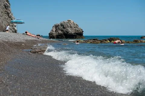 Wave on a beach. Stock Photos
