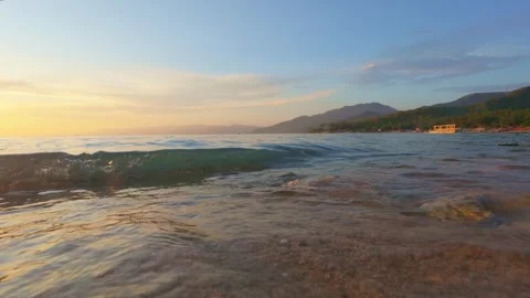 Wave on a Beach at Sunset. Slowmotion Video stock 308992846