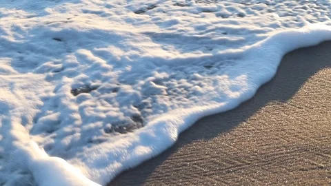 Wave on the beach washing over sand Stock Footage 112766418