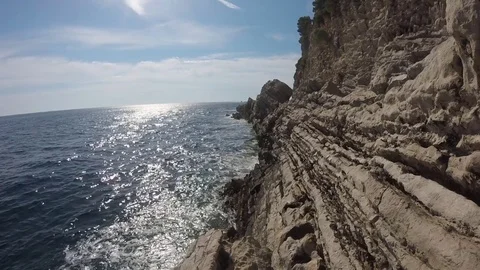Wave beating on the rocky headland video Stock Footage 82259985