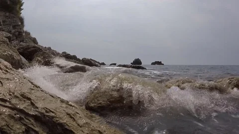 Wave beating on the rocky headland video Stock Footage 82261571