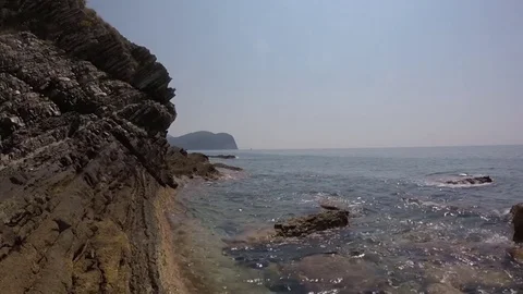Wave beating on the rocky headland video Stock Footage 82263254