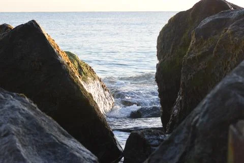 Wave between the rocks Stock Photos