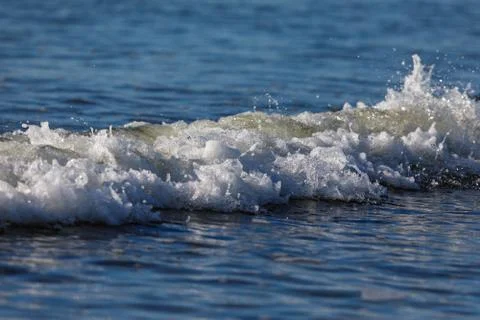 Wave in blue ocean Stock Photos