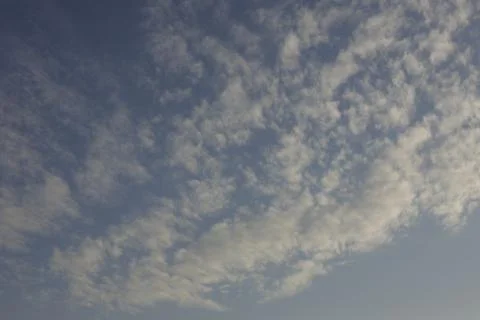 Wave-like, blue puffy clouds during day Stock Photos