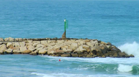 Wave Breaker on beach tel aviv Stock Footage 25181135