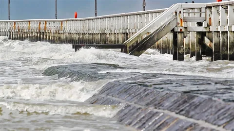 Wave breaker under high tide at Nieuwpoort pier, Bellgium Stock Footage 89653802