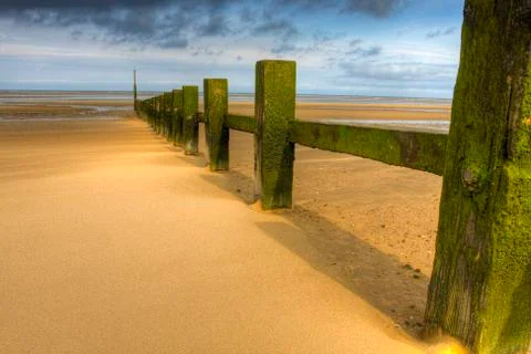 Wave breakers at sunne beach Stock Photos