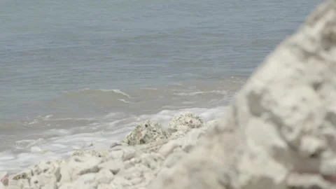 Wave breaking against rocks Stock Footage 340821691