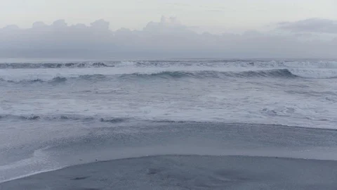 Wave Breaking on The Beach on Twilight Sky Stock Footage 128948147
