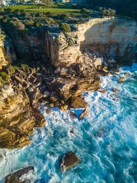 Wave Breaking Cliff Stock Photos
