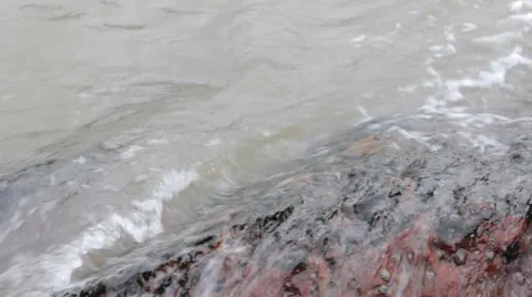 Wave breaking on a rock Stock Footage 43402732