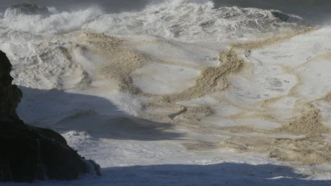 Wave breaking on a rock Stock Footage 88620779