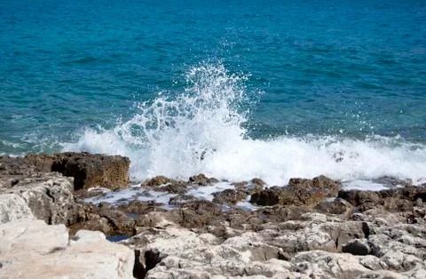 Wave breaking on the shore Stock Photos