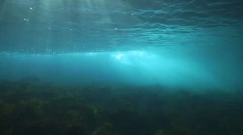 Wave breaking from under the water. Stockbeeldmateriaal 49788913