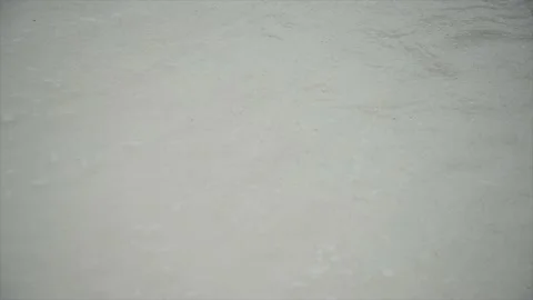 A wave breaking on a white sand beach Stock Footage 146971877