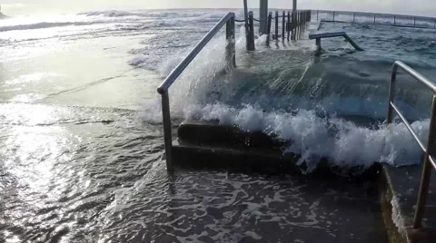 Wave breaks over rock pool slow motion Mona Vale NSW Australia Video stock 54708441