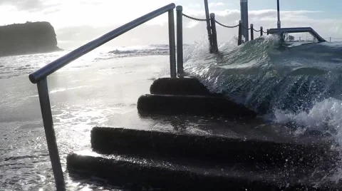 Wave breaks over rock pool MS slow motion Mona Vale NSW Australia. Video stock 54708475