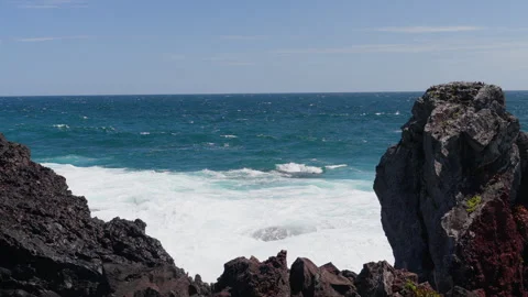 Wave breaks on the rocks at eastern shore of Jeju-do Island, South Korea Stock Footage 288570991
