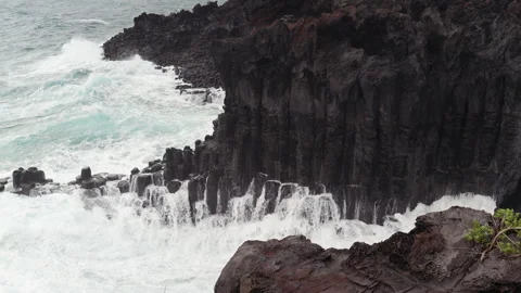Wave breaks on the rocks at eastern shore of Jeju-do Island, South Korea Stock Footage 289420346