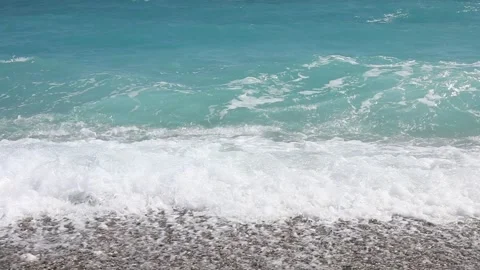 Wave breaks slow motion on a pebble beach Stock Footage 153834100