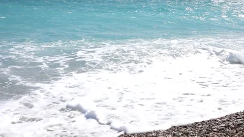 Wave breaks slow motion on a pebble beach Stock Footage 153834161