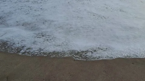 Wave bubbles moving at the beach Stock Footage 291123054