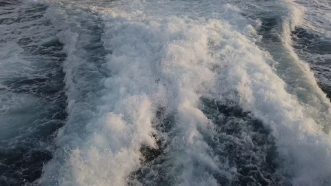 Wave caused by a ship while sailing in the sea Stock Footage 123750576