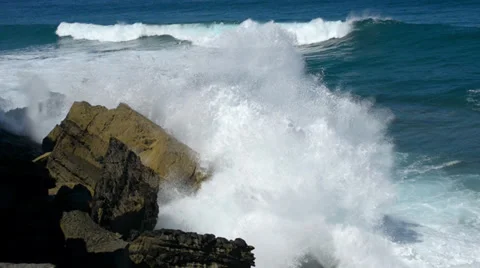 Wave chrushing onto rock slow motion 11091 Stock Footage