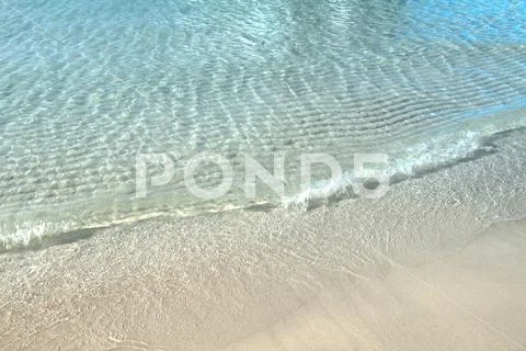 Wave of the clear blue ocean on tropical white sand beach at Koh Larn, Patt.. Stock Photos